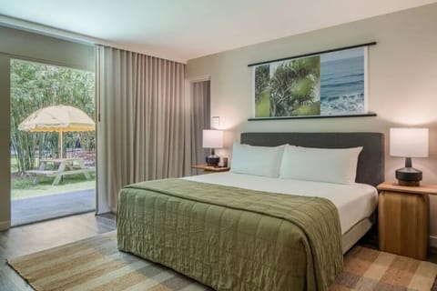 Unwind in a serene bedroom with garden patio views.