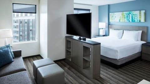 Settle into a bright suite with lounge space and views.