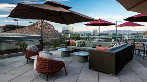 Sip cocktails under string lights on the rooftop terrace.