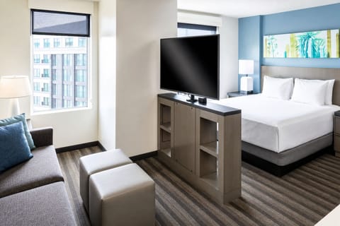 Settle into a bright suite with lounge space and views.