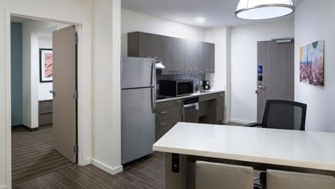 Cook and dine with ease in a sleek, modern kitchenette.