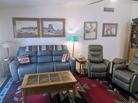Couch seats 3, with recliners on both ends. Two individual recliners.
