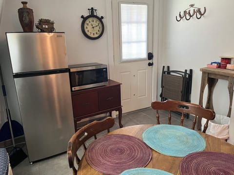 Kitchen with fridge & microwave