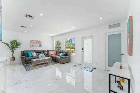 Cozy meets modern in this bright, open-concept living space; perfect for lounging, entertaining, or just soaking up the Florida vibes in style!