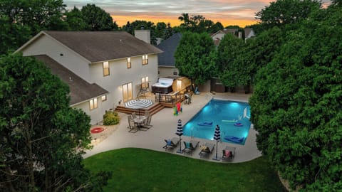 The fully fenced in backyard features your very own private pool heated to 85 degrees, hot tub, sauna, fire pit, dining set, pool lounge furniture, basketball hoop, pool toys, corn hole, connect 4, giant jenga, and propane gas grill.