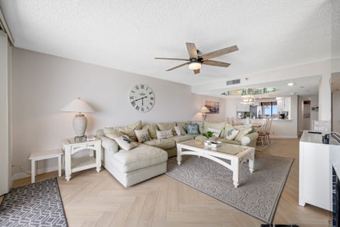 Coastal Livingroom with smart Tv, fan & balcony access