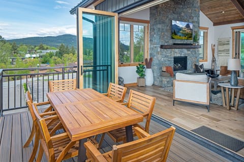 With accordion doors to two patios, the main living space expands to the great outdoors | Exterior