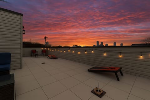 Enjoy stunning skyline views from this spacious rooftop deck. Perfect for relaxation and evening cocktails.