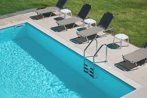 Private pool with sunbeds& crystal-clear water–luxury villa relaxation-Halkidiki