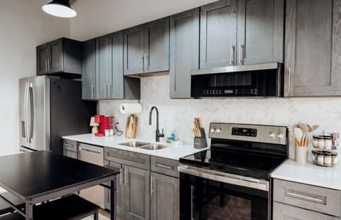 A modern kitchen equipped with sleek appliances and all the essentials to inspire your inner chef and make meal prep a breeze