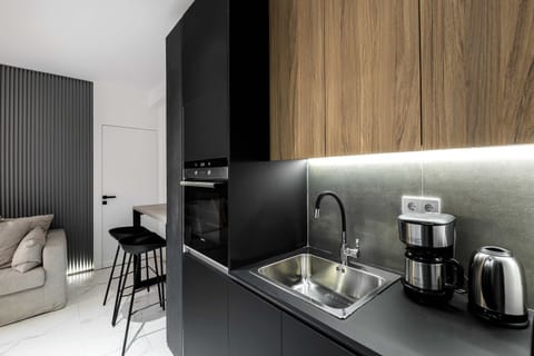 Compact kitchen workspace with coffee setup keeps mornings smooth before heading out exploring.