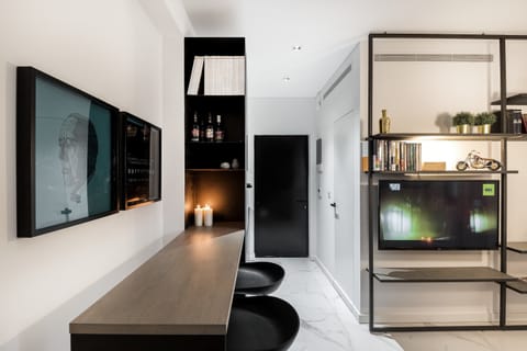 Minimal dining nook provides a practical spot for quick bites or planning city adventures.
