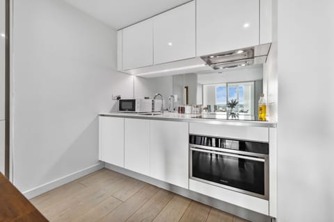 Enjoy the convenience of a stylish, fully equipped kitchenette—perfect for preparing quick bites or cozy dinners during your stay.