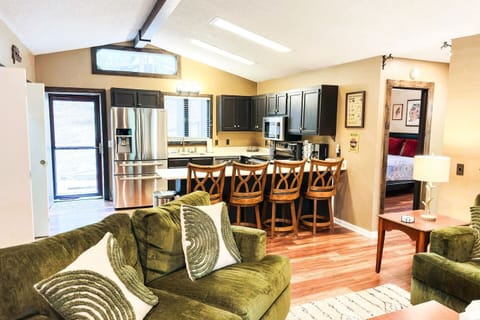 Full kitchen with modern appliances and seating for 8, perfect for post-slope meals.