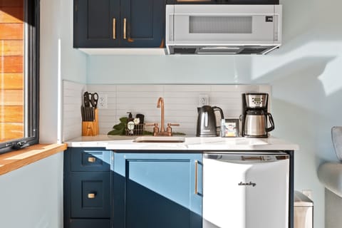 mini fridge, coffee maker, kettle, microwave