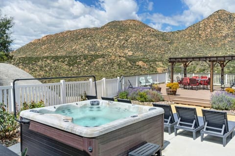 Soak yourself in this hot tub set against a sweeping outdoor backdrop.