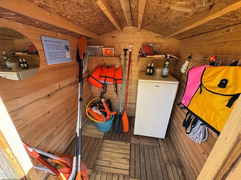 Lake terrace has a fridge on the side…and the fins, masks and floaters..