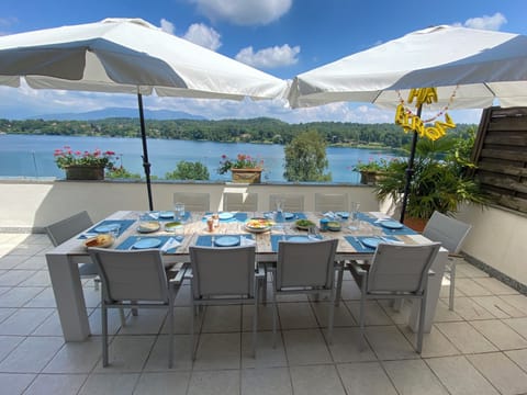 Large sun terrace with 10 person table with lake and mountain view