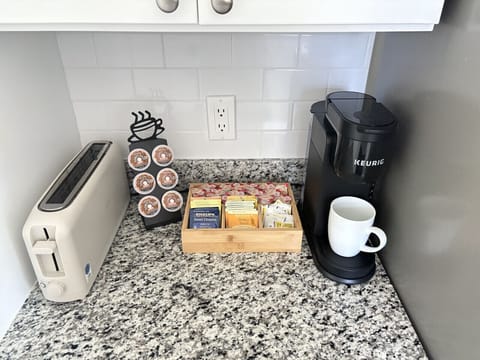 Kickstart your morning at our cozy coffee and tea station, fully stocked with K-cups, a variety of teas, and all the essentials.