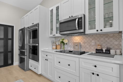 Kitchen: Modern appliances and elegant details invite culinary adventures in this stylish space!