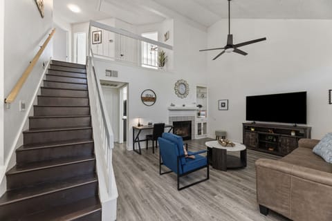 Spacious open-concept living room perfect for relaxing or game nights.