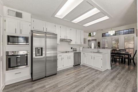 Fully equipped kitchen with modern appliances.