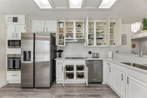 Fully equipped kitchen with modern appliances.
