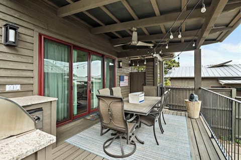 Deck with bbq grill and seating area.