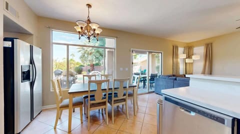 Enjoy a meal and the peaceful view of the backyard in this perfect dining space.