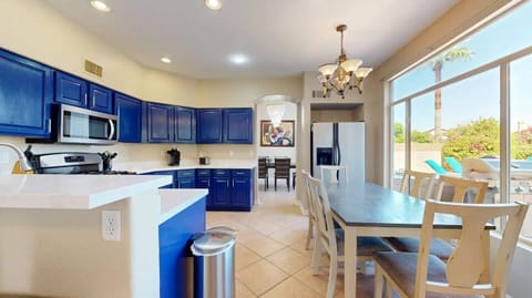 Enjoy a meal and the peaceful view of the backyard in this perfect dining space.