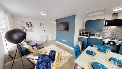 Open-plan kitchen, living, and dining area creates a spacious, social atmosphere.