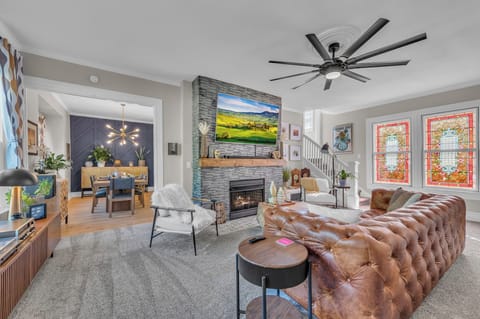 Chic living room with stained glass, fireplace & upscale modern design