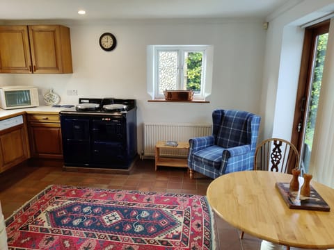 Kitchen with access to garden patio, breakfast table seats 3