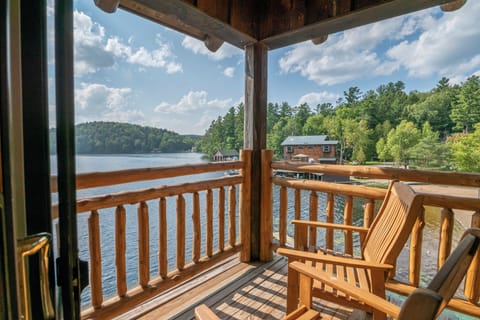 Townhouse on Lower Saranac Lake has two balconies directly over the water.