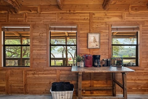Enjoy your morning coffee at the dedicated coffee bar with lake views—featuring a Keurig, drip coffee maker, and all the essentials for the perfect start to your day.