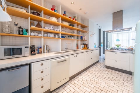 Ground floor: Kitchen with a fridge-freezer, dishwasher,  and plenty of prep space
