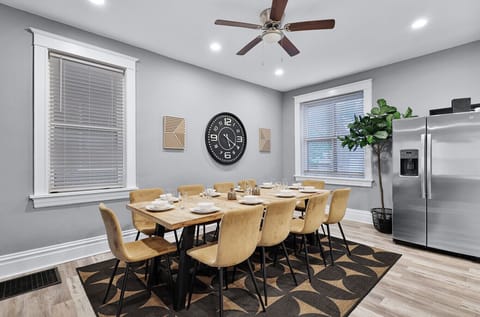 Dine in style with this spacious 10-seat dining area, complemented by a nearby fridge/freezer for easy food and drink storage, adding convenience to your meals.