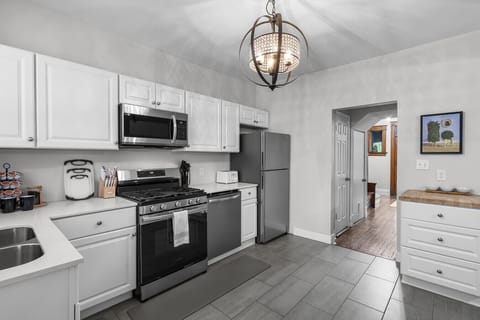 Our fully stocked kitchen boasts modern stainless steel appliances such as an oven/range, refridgerator/freezer,dishwasher and microwave, alongside all the cookware and utensils you need for a comfortable stay.