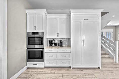 Double oven and coffee bar.