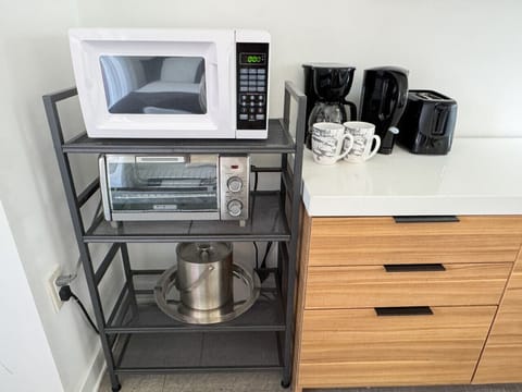 Coffee maker,  microwave, and a minibar fridge.