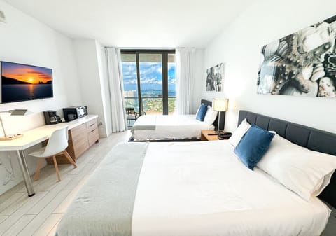 Spacious bedroom with a double bed and blackout curtains, perfect for restful nights.