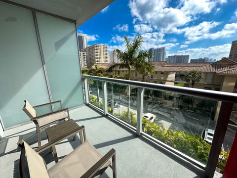Private balcony with outdoor seating and refreshing views.