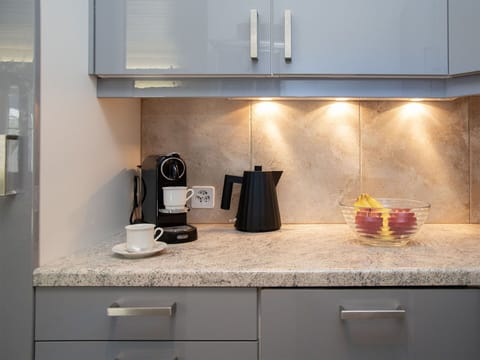 Countertop, Kitchen Appliance, Kitchen, Cabinetry, Interior Design, Home Appliance, Furniture, Major Appliance, Flooring, Lighting