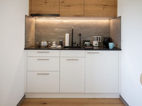 Kitchen, Countertop, Interior Design, Kitchen Appliance, Wood, Cabinetry, Furniture, Flooring, Lighting, Home