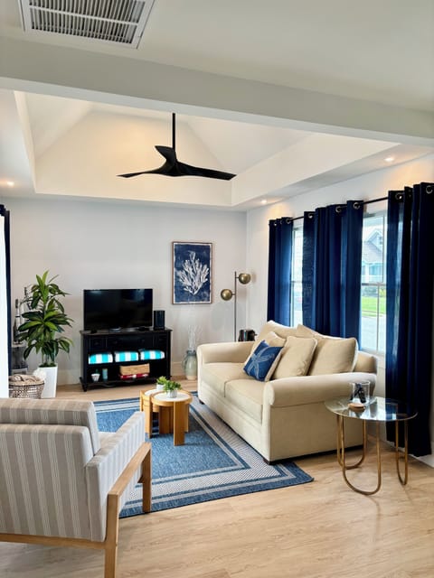 Living room: Full sleeper sofa, Sonos, streaming ready TV, ceiling fan. 