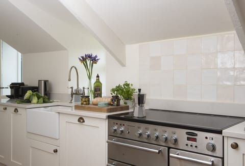 Besloe, Tintagel. Ground Floor: With an electric range cooker and Belfast sink