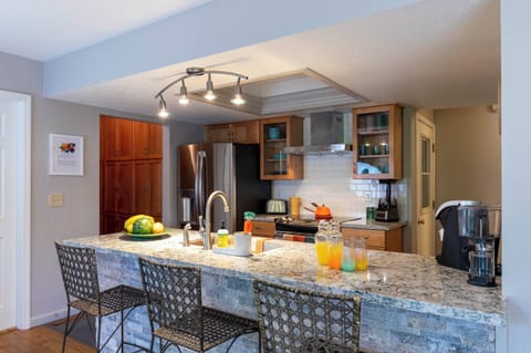 Well-appointed kitchen, including a crockpot, blender, plenty of pots and pans.