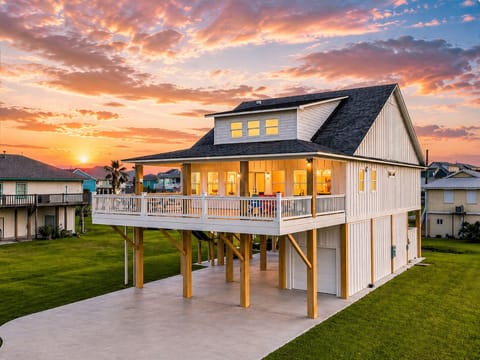 Side view of vacation home with wraparound deck and ample outdoor space