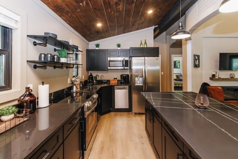 This fully stocked kitchen includes stainless steel appliances, a Keurig coffee machine, and all the cookware, utensils, and dishes you’ll need.