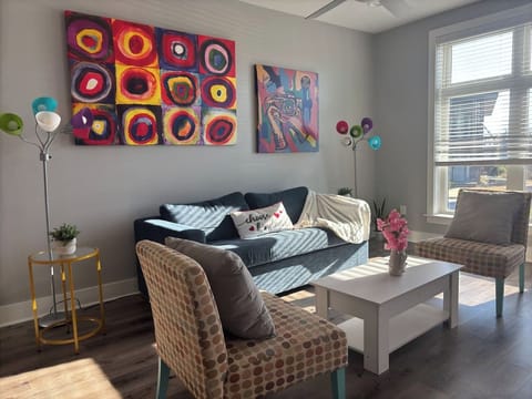 Living Room: Bright and artsy retreat with playful decor and abundant natural light!